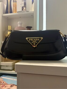Prada Black Leather Shoulder Bag with Gold Logo Plaque